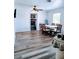 This well-lit dining room features ample space, light-colored floors, and a fireplace view at 1649 W Waycross Cir, Deltona, FL 32725