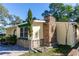 Side view of the house showcasing stone details and landscaping at 1649 W Waycross Cir, Deltona, FL 32725