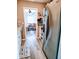 View of kitchen with stainless steel refrigerator and view to dining room at 1649 W Waycross Cir, Deltona, FL 32725