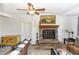 Living room displaying a stone fireplace, artwork, and comfortable furnishings at 1649 W Waycross Cir, Deltona, FL 32725