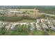 Aerial view of houses near a golf course and conservation at 189 Perfect Dr, Daytona Beach, FL 32124