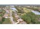 Birds-eye view of homes, a lake and golf course in the neighborhood at 189 Perfect Dr, Daytona Beach, FL 32124