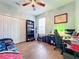 Bedroom with tile floors, desk, and built-in shelving at 189 Perfect Dr, Daytona Beach, FL 32124