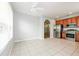 Bright dining area with tile flooring adjacent to the modern kitchen at 189 Perfect Dr, Daytona Beach, FL 32124