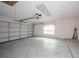 Spacious two-car garage with ample room for parking and storage, featuring a paneled garage door at 189 Perfect Dr, Daytona Beach, FL 32124