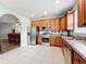 Spacious kitchen with wood cabinets, stainless steel appliances, and tile floor at 189 Perfect Dr, Daytona Beach, FL 32124