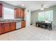 Kitchen with wood cabinets, stainless steel appliances, and tile flooring at 189 Perfect Dr, Daytona Beach, FL 32124