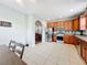 Kitchen with wood cabinets, stainless steel appliances, and tile flooring at 189 Perfect Dr, Daytona Beach, FL 32124