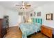 Spacious main bedroom with ensuite bathroom access and a teal comforter at 189 Perfect Dr, Daytona Beach, FL 32124