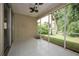 Screened patio with tile flooring overlooking the landscaped backyard, ideal for outdoor relaxation at 189 Perfect Dr, Daytona Beach, FL 32124