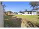 Spacious backyard with a large grassy area and shed at 1911 S Palomar Dr, Deltona, FL 32738