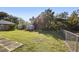 Fenced backyard with grassy lawn and storage shed at 1911 S Palomar Dr, Deltona, FL 32738