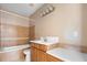 Clean bathroom with light brown tile and a new vanity at 1911 S Palomar Dr, Deltona, FL 32738