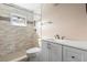 Updated bathroom with white vanity, tile shower, and new fixtures at 1911 S Palomar Dr, Deltona, FL 32738