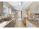 Updated kitchen with granite counters and gray cabinets at 1911 S Palomar Dr, Deltona, FL 32738