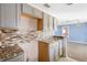 Granite countertops and gray cabinets in this kitchen at 1911 S Palomar Dr, Deltona, FL 32738