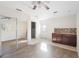 Small kitchenette with dark wood cabinets and granite countertop at 1911 S Palomar Dr, Deltona, FL 32738