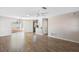 Bright living room with wood-look floors and ceiling fan at 1911 S Palomar Dr, Deltona, FL 32738