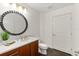 Bathroom with modern vanity, large mirror, and tile floor at 1925 S Atlantic Ave # 706, Daytona Beach, FL 32118