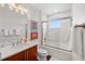 Elegant bathroom with a tub, vanity, and modern fixtures at 1925 S Atlantic Ave # 706, Daytona Beach, FL 32118