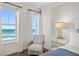 Bedroom with ocean view and comfortable seating area at 1925 S Atlantic Ave # 706, Daytona Beach, FL 32118