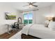 Main bedroom with a work area, king bed, and balcony access at 1925 S Atlantic Ave # 706, Daytona Beach, FL 32118