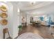 Open concept dining area with hardwood floors and a view to the living room at 1925 S Atlantic Ave # 706, Daytona Beach, FL 32118