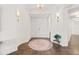 Elegant entryway with a circular rug and neutral color palette at 1925 S Atlantic Ave # 706, Daytona Beach, FL 32118
