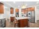 Updated kitchen with wood cabinets and center island at 1925 S Atlantic Ave # 706, Daytona Beach, FL 32118