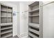 Large walk-in closet with shelving and drawers at 1925 S Atlantic Ave # 706, Daytona Beach, FL 32118