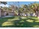 Spacious backyard with fenced perimeter and grassy lawn at 2125 Queen Palm Dr, Edgewater, FL 32141