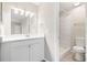Clean bathroom with white vanity and a walk-in shower at 2125 Queen Palm Dr, Edgewater, FL 32141