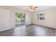 Bedroom with sliding glass doors to the backyard at 2125 Queen Palm Dr, Edgewater, FL 32141