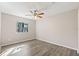 Spacious bedroom with ceiling fan and wood-look floors at 2125 Queen Palm Dr, Edgewater, FL 32141