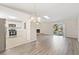 Open living room with kitchen and fireplace views at 2125 Queen Palm Dr, Edgewater, FL 32141
