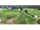 Aerial view of golf course with clubhouse and landscaping at 24502 Calusa Blvd, Eustis, FL 32736