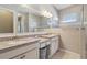 Double sink bathroom with granite countertop, and a large mirror at 2815 Sienna View Ter, New Smyrna Beach, FL 32168