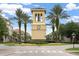 Community entrance with clock tower and palm trees at 2815 Sienna View Ter, New Smyrna Beach, FL 32168
