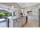 Modern kitchen with granite island and stainless steel appliances at 2815 Sienna View Ter, New Smyrna Beach, FL 32168