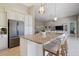 Kitchen island boasts granite counters, a breakfast bar, and ample space for food preparation and entertaining at 2815 Sienna View Ter, New Smyrna Beach, FL 32168