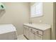 Functional laundry room with counter space, ample cabinets, and a convenient utility sink at 2815 Sienna View Ter, New Smyrna Beach, FL 32168