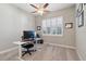 Dedicated office with a large window, modern desk, and neutral decor perfect for remote work at 2815 Sienna View Ter, New Smyrna Beach, FL 32168