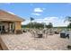 Community patio with tables and fire pit at 2815 Sienna View Ter, New Smyrna Beach, FL 32168