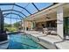 Relaxing screened-in pool with a waterfall feature at 2815 Sienna View Ter, New Smyrna Beach, FL 32168