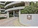 The entrance to the parking garage features a paved road with manicured landscaping at 3 Oceans West Blvd # 4A5, Daytona Beach Shores, FL 32118
