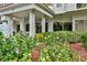 Welcoming entrance with manicured flower beds and attractive architectural details at 3 Oceans West Blvd # 4A5, Daytona Beach Shores, FL 32118