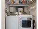 Functional laundry room with a modern Samsung washer and dryer at 3 Oceans West Blvd # 4A5, Daytona Beach Shores, FL 32118