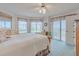 Spacious main bedroom featuring neutral colors, lots of natural light, and balcony access at 3 Oceans West Blvd # 4A5, Daytona Beach Shores, FL 32118