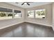 Bright bedroom with dark hardwood floors and multiple windows at 3070 Grand Ave, Deland, FL 32720