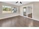 Spacious bedroom with hardwood floors and sliding glass doors to patio at 3070 Grand Ave, Deland, FL 32720